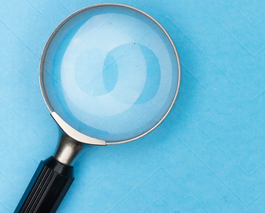 Magnifying glass for investigation or case study.